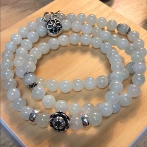 Jade bracelet with silver charms